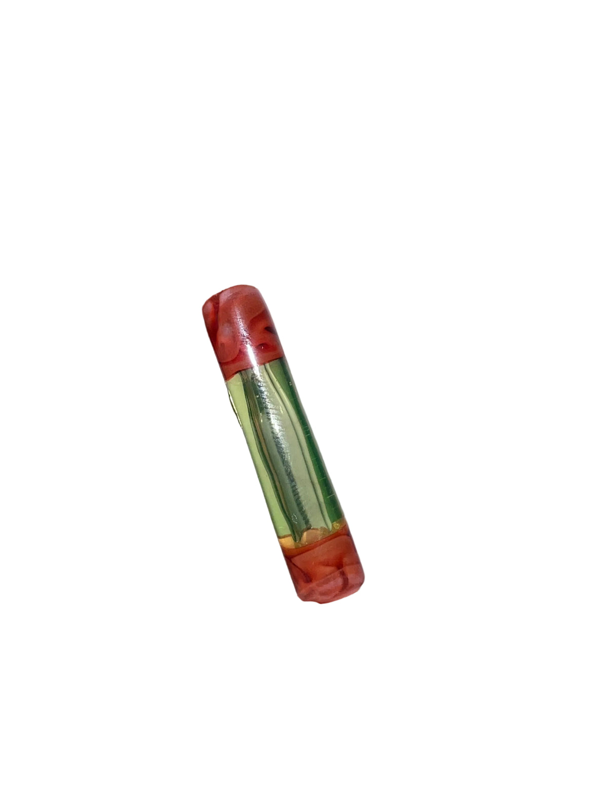 Boquilla UV Ion reaccionando bajo luz ultravioleta con un intenso brillo verde fluorescente.